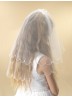 A two tier white tulle scalloped edge Holy Communion Veil for your choice o...